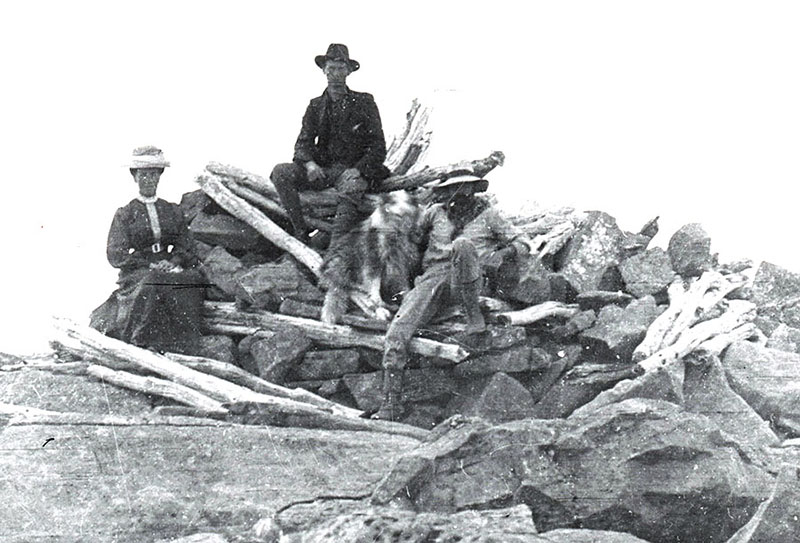 Kate Weindorfer, Ron Smith and WM Black at the survey cairn on the summit of Cradle Mountain, Jan 1910